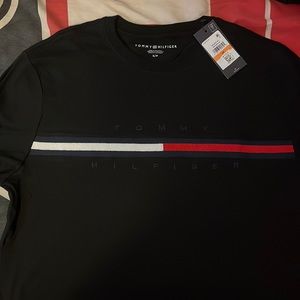 Tommy shirt brand new with tagging on it selling for 40 original price 60